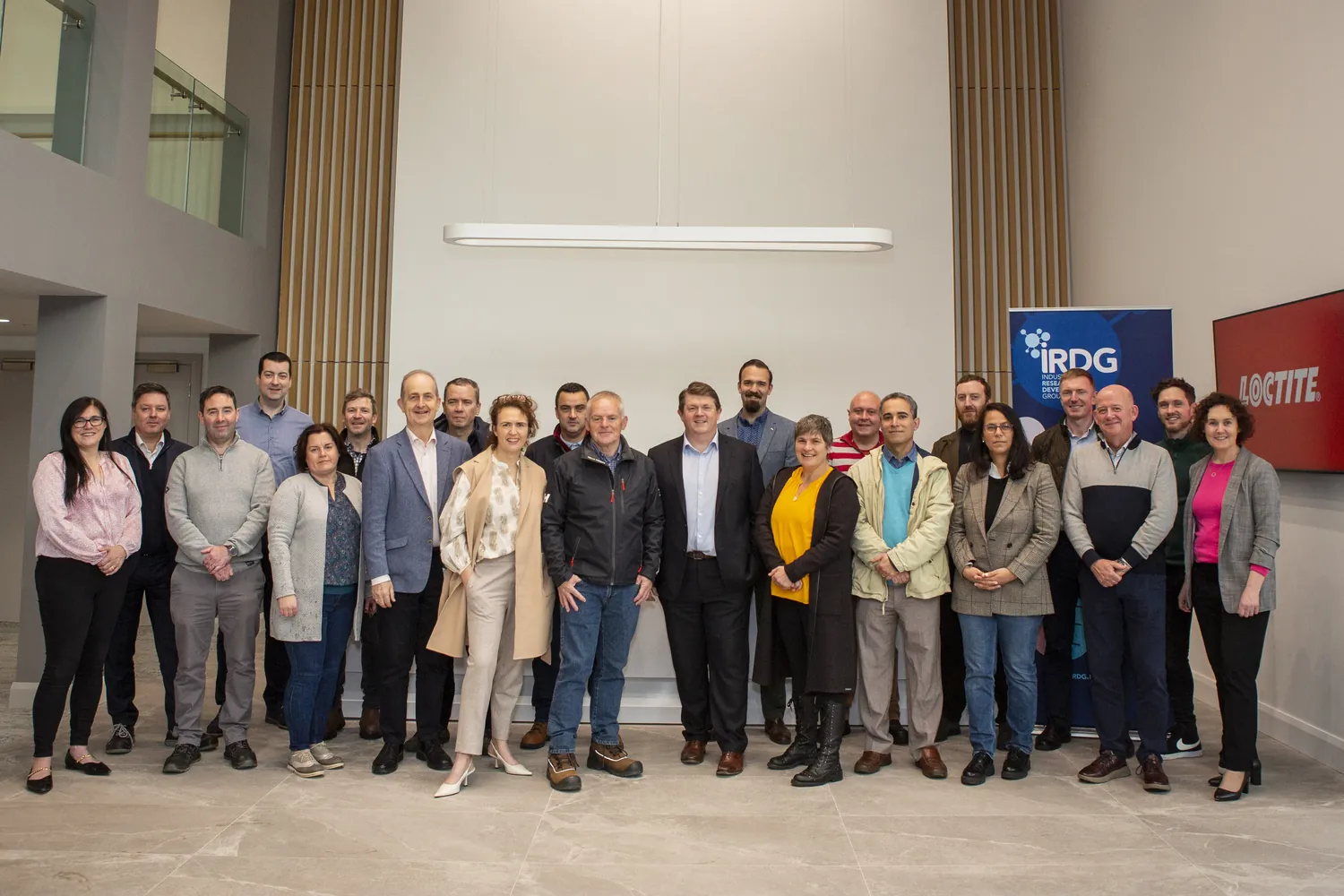 An IRDG member group at Henkel's Irish site, gathered in the reception atrium.